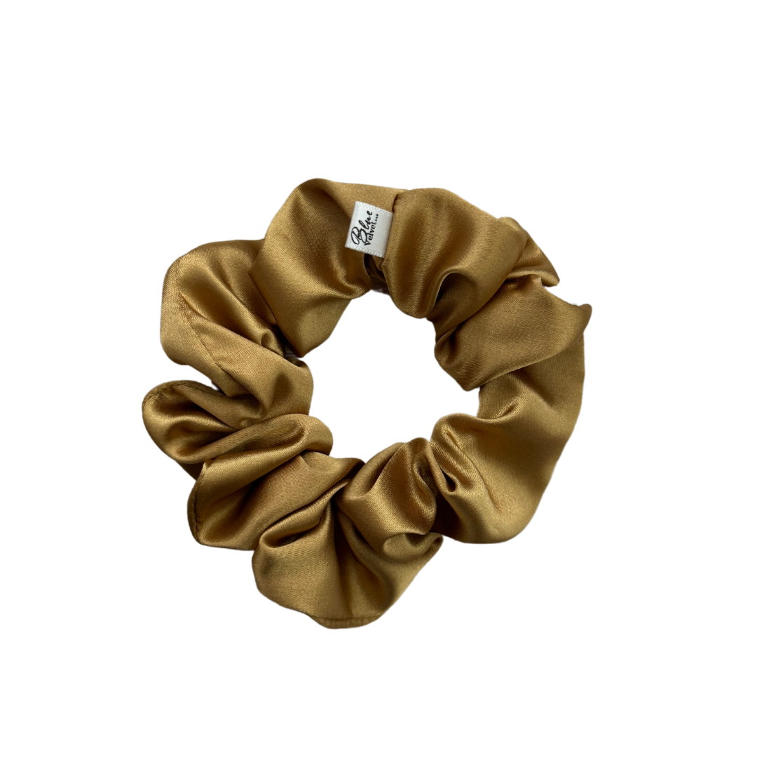 A gold satin scrunchie.