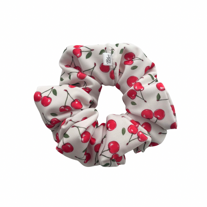 White XL Swim Scrunchie with cherry pattern.