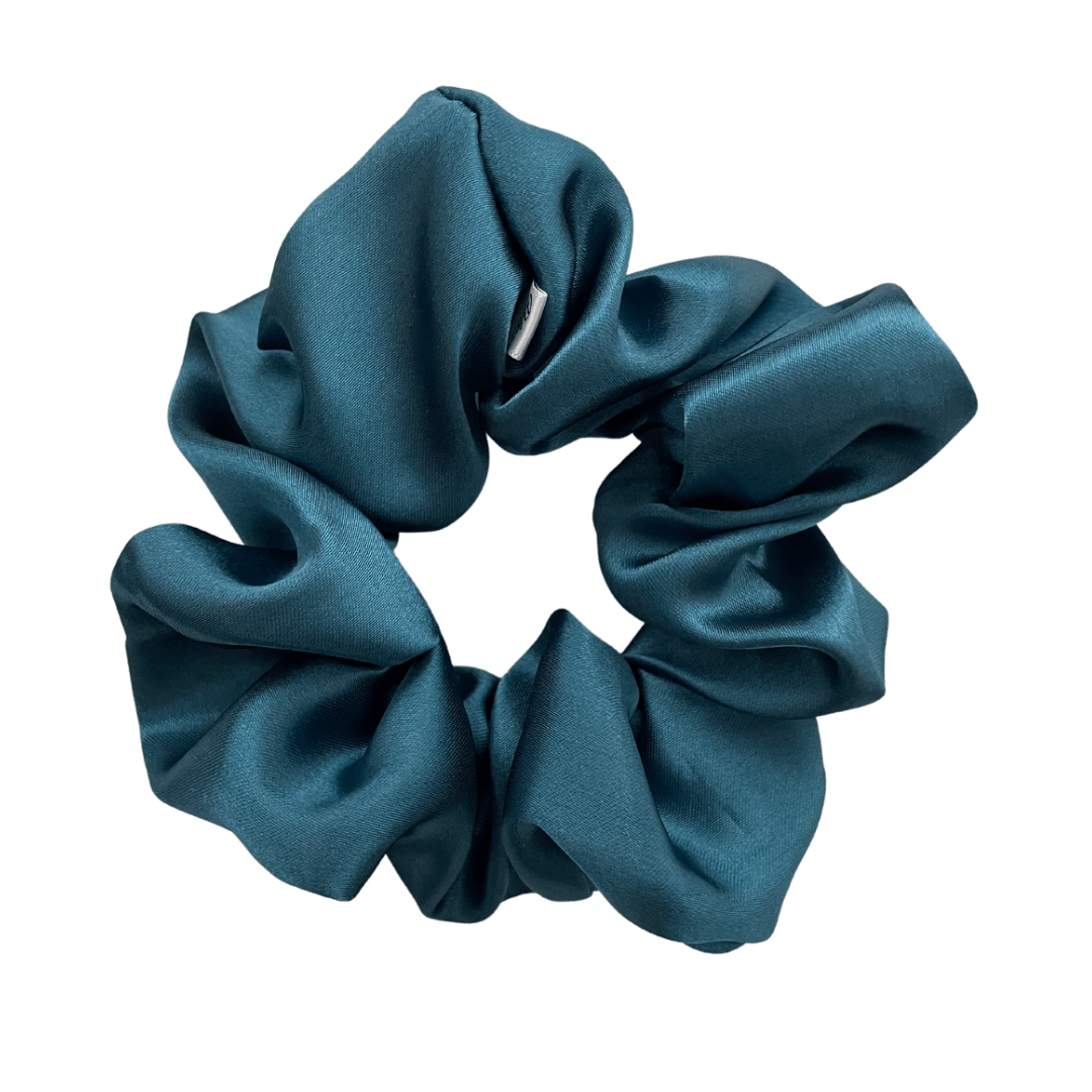 A deep turquoise XL satin scrunchie.
