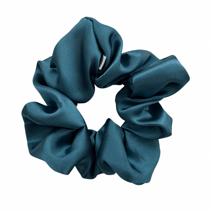 A deep turquoise XL satin scrunchie.